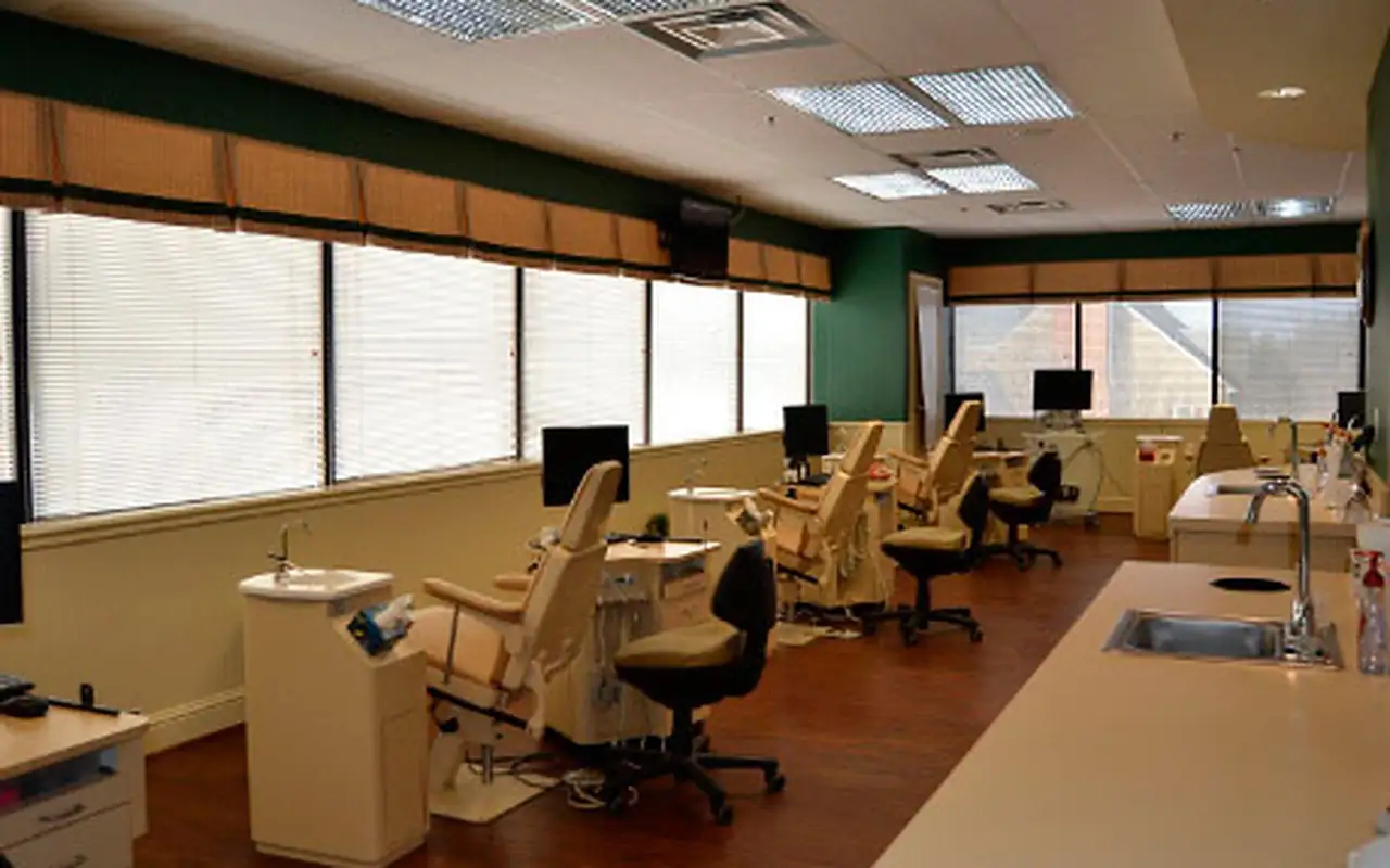 The open treatment bay at McInnes Palmer Orthodontics in Towson, with its row of orthodontic chairs under the windows.