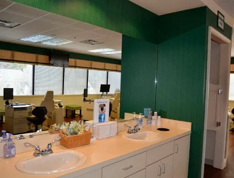 The brushing station at the Towson office, with sinks, toothbrushes and supplies for patients.